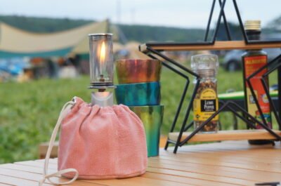 キャンプ女子にも！ガス缶を優しくくるむカバーKINCHAKU（きんちゃく）を発売